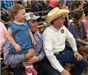 Sheriff and a Family at a Rodeo
