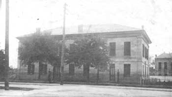 Black and white image of two story building