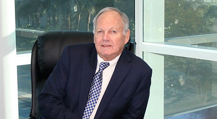 Ken Taylor sitting behind desk
