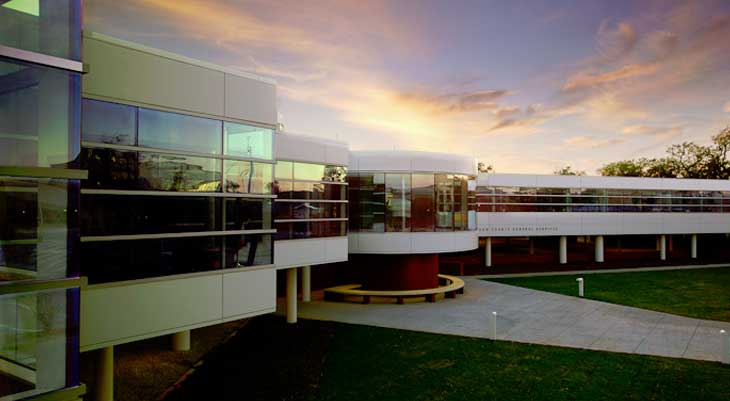 Image of large glass building at dusk